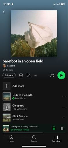 an open field with music player on the screen and text below it that reads barefoot in an open field