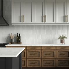 a kitchen with wooden cabinets and marble counter tops, along with a white tiled backsplash