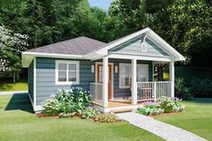 a small blue house sitting on top of a lush green field