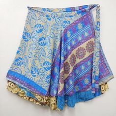 Indian Vintage Silk Wrap around magic long skirts for women, its free size wraps Reversible Tie skirts. Our skirt is handmade by our artisans in India out of recycled saris and turned into the beautiful finished skirt you see. With your help, these artisans are able to sustain year-round employment. Every skirt is truly an original made with exotic reclaimed materials. This skirt has the unique combination of designs and final touch of thread work on its corners which makes the product look arti Bohemian Long Skirt For Navratri, Bohemian Skirt For Navratri, Bohemian Tiered Skirt For Festive Occasions, Multicolor Wrap Skirt For Festivals, Traditional Multicolor Long Wrap Skirt, Traditional Tiered Wrap Skirt For Festival, Blue Long Wrap Skirt For Festival, Multicolor Belly Dance Skirt For Festivals, Festive Bohemian Multicolor Bottoms