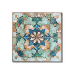 an artistic tile design in green, orange and blue with a flower on the center