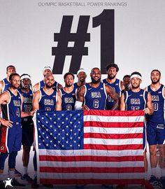 the usa men's basketball team is holding an american flag