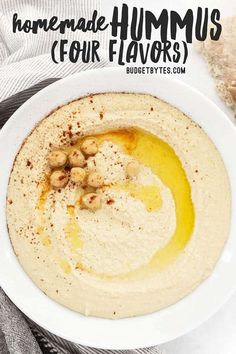 hummus in a white bowl with cashews on top and text overlay that reads homemade hummus four flavors