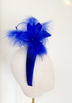 Little Hats for Grand Occasions. Customer information and sizing. Royal blue,cobalt blue feathers and hand curled quills on a velvet padded headband, fascinator, halo.  Perfect statement headband for weddings, special events, racing or a grand occasion. Embellishments, feathers, buttons and brooches are lovingly sourced for unique individual pieces. Headband measures 4cm at it's top widest point and sits comfortably on the head. Handmade in the UK. No two designs are the same. Please message me to discuss any personnal requirements. Return and exchanges except within 14 days. Please read the full details in the FAQS. Many more designs on the shop. Statement Headband, Headband Fascinator, Blue Feathers, Blue Cobalt, Wedding Fascinators, Padded Headband, Blue Feather, Wedding Hair Accessories, Cobalt Blue