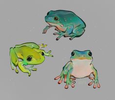 three different colored frogs sitting next to each other