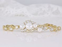 three different types of pearl and diamond bracelets