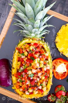 the pineapple has been sliced into small pieces and is ready to be served with other fruit