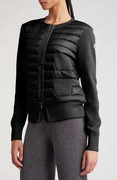 Get the look of a high-tech Moncler puffer with the cozy style of a wool cardigan in this mixed-media piece created with stitchless quilting and grosgrain trim. Two-way front-zip closure Crewneck Long sleeves Front patch pockets Partially lined, with down fill Back/sleeves are 100% virgin wool; front panel is 100% nylon Dry clean Imported Designer Clothing Black Merino Wool Outerwear For Cold Weather, Black Merino Wool Outerwear With Ribbed Cuffs, Moncler Puffer, Cozy Style, Cozy Fashion, Wool Cardigan, Get The Look, High Tech, Designer Clothing