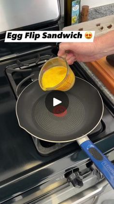 a person pouring orange juice into a frying pan on top of an open stove