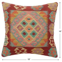 a red and blue pillow with an intricate design on it, measurements for the size