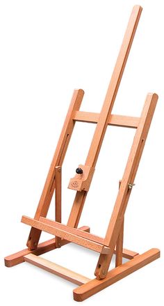 a wooden easel sitting on top of a white floor