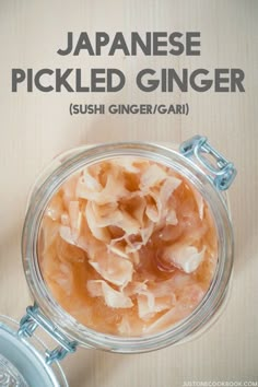 a jar filled with sliced ginger sitting on top of a table