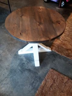 a wooden table sitting on top of a carpeted floor