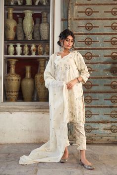 The set consists of off white straight cut kurta, 3/4th sleeves, round neck, knee length teamed with straight pants and a dupatta to match.The entire set has beautiful taari work. Suit Fabric-Cotton Dupatta Fabric-Cotton Doria Kurta Length-38 inches Pant Length-36 inches The model is wearing size small. Washing Care-Wash Separately Kurta Palazzo Set, White Kurta, Palazzo Suit, Palazzo Set, Indian Fashion Designers, Suit Fabric, Pernia Pop Up Shop, Matching Pants, Kurta Set