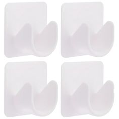 four white plastic wall hooks on a white background