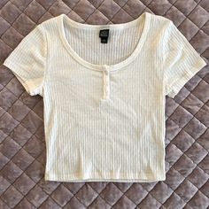 Button Up Pleated Baby Tee. Brand New Without Tags And Never Worn. Pet And Smoke Free Home. Cute White Tops With Buttons, Basic Button-up Top, Basic Tops With Button Closure For Summer, White Fitted T-shirt With Button Closure, Basic Spring Tops With Button Closure, Basic Tops With Button Closure For Spring, White Buttoned Top For Everyday Wear, Basic Short Sleeve Tops With Buttons, Wild Fable