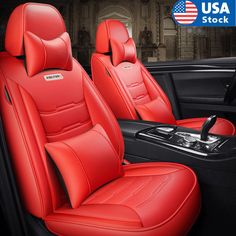 the interior of a car with red leather upholstered seats and american flag in background