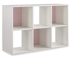 a white shelving unit with four sections