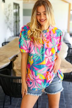 Refresh your casual closet while adding a touch of femininity with this puff sleeve woven top. A stunning frilled mock neck and button keyhole back complete this versatile and stunning floral print top. Haptics Tropical Floral + Frilled Mock Neck + Puff Sleeve Woven - No Stretch 100% POLYESTER Designed in California Fits Loose Weight: .395 Lbs; plus .455 Lbs Bust (side seam to side seam): S 20" M 21" L 22" 1X 24" 2X 25" 3X 26" Length (shoulder to hem): S 27" M 28" L 29" 1X 31" 2X 32" 3X 33" Regu Denim Blouse, Mock Neck Top, Top Graphic Tees, Floral Print Tops, Woven Top, Tropical Floral, Tropical Print, Print Top, Print Tops