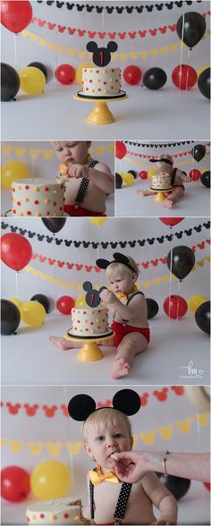 a baby in mickey mouse costume sitting on top of a cake with balloons and confetti