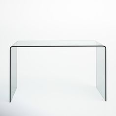 a glass table with a black frame on the top and bottom, against a white background