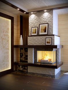 a fire place in a living room with pictures on the wall