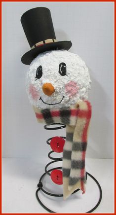 a snowman wearing a hat and scarf