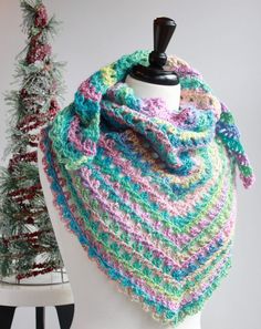 a crocheted scarf on top of a white mannequin with text overlay that says free crochet pattern nana's crafty home