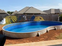 an above ground swimming pool in a backyard