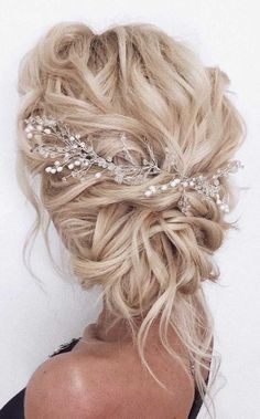 a woman with blonde hair wearing a wedding hairstyle