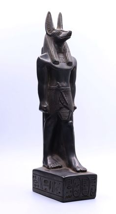 an egyptian statue is shown against a white background