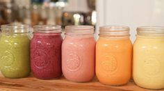 five different colored smoothies lined up next to each other