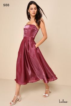 If you're aiming to stun, you'll always make the right choice when you wear the Lulus Radiant Direction Mauve Purple Strapless Midi Dress With Pockets! Lightweight woven organza, with a luxe sheen throughout, shapes a strapless, corset-inspired bodice with a subtle sweetheart neckline, no-slip strips, hidden supportive boning, seaming details, and stunning sheer panels at the back. Banded waist tops a flaring skirt with side seam pockets, box pleats, and hidden tulle for volume, finishing at a m Pink Strapless Midi Length Feminine Dress, Flowy Mauve Midi Dress, Pink Feminine Strapless Midi Dress, Chic Purple Strapless Midi Dress, Purple Strapless Satin Dress, Organza Midi Dress, Midi Dress With Pockets, Mauve Purple, Strapless Corset