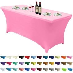 a pink table cloth with two wine glasses and plates on it, all in different colors