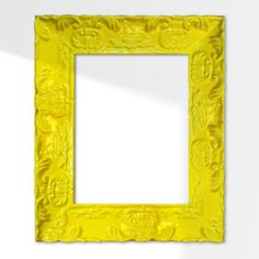 an ornate yellow frame hanging on the wall