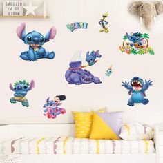 the wall stickers in this children's room are decorated with cartoon characters