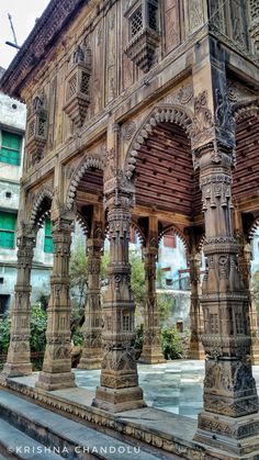 an old building with many pillars and arches