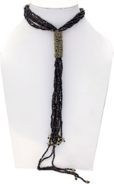 Diffused Black Beads get together in a tie around neck and come all the way down to the waist in this Black Beads Necklace with Metal Silver on the tie. The length is 28 inches, with no hooks (i.e one size), and the drop is for 12 inches. Adjustable Beaded Necklace With Large Beads For Party, Adjustable Lariat Beaded Necklaces For Parties, Adjustable Beaded Chain Necklace For Party, Adjustable Beaded Lariat Necklace For Parties, Adjustable Beaded Chain For Party, Adjustable Beaded Necklace For Party, Adjustable Multi-strand Choker For Party, Adjustable Multi-strand Beaded Lariat Necklace, Elegant Adjustable Choker With Dangling Beads