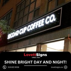 a sign that says lovett signs shine bright day and night on the side of a building