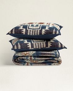 three pillows stacked on top of each other