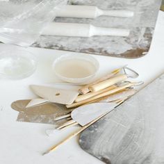 the tools are sitting on the table ready to be used for making cake decorating