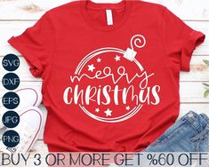 a red t - shirt with the words merry christmas written in white ink on it