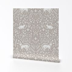 a white and grey wallpaper with an animal pattern in the middle, against a white background