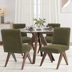 a dining room table with six chairs around it