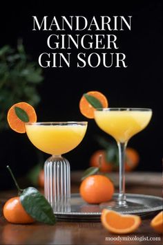 the mandarin ginger gin sour cocktail is garnished with orange slices