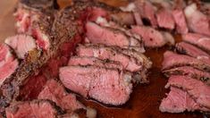 sliced meat sitting on top of a cutting board