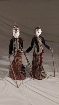 Description: Dive into the rich cultural heritage of Indonesia with this exquisite set of two Wayang Golek wooden stick puppets, each standing 18.5 inches tall. Crafted by skilled artisans, these puppets showcase the traditional art form with intricate details and vibrant costumes, making them perfect for collectors, cultural enthusiasts, or as a unique decorative addition to your home. Each puppet is meticulously hand-painted and dressed in traditional fabrics, featuring distinctive designs that reflect their storied origins in Indonesian puppet theater. These puppets are not only beautiful display pieces but also functional art, ideal for educational purposes or theatrical performances. Available for purchase individually or as a discounted pair, these Wayang Golek puppets offer a wonder Wayang Golek, Puppets Diy, Cultural Artifact, Indonesian Art, Puppet Theater, Traditional Fabric, Functional Art, Cultural Heritage, Art Object