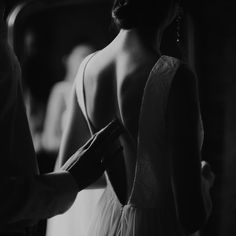 the back of a woman's dress in black and white