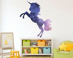 a child's room with a unicorn wall decal