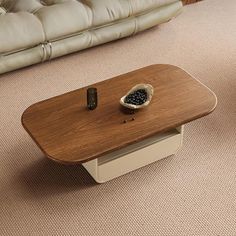 a coffee table that has some sort of bowl on it